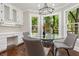 Charming breakfast nook with backyard views, featuring custom cabinetry, a built-in desk, and modern lighting at 1183 Woods Ne Cir, Atlanta, GA 30324