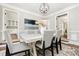Dining room featuring modern decor, neutral tones, and a stylish light fixture above a large dining table at 1183 Woods Ne Cir, Atlanta, GA 30324