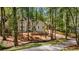 Charming two-story home nestled among mature trees, featuring elegant architectural details and a private setting at 1183 Woods Ne Cir, Atlanta, GA 30324