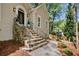 Inviting front entrance featuring stone steps, black railings, and a beautifully designed front door with an arch window at 1183 Woods Ne Cir, Atlanta, GA 30324