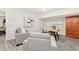 A comfy home office features calming gray chairs, modern art, and a wood desk, all naturally lit at 1183 Woods Ne Cir, Atlanta, GA 30324