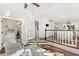Open living area with a partial view of a modern kitchen featuring stainless appliances and custom cabinetry at 1183 Woods Ne Cir, Atlanta, GA 30324
