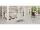 Upstairs playroom featuring soaring ceilings, an abundance of natural light, and luxury vinyl floors at 1183 Woods Ne Cir, Atlanta, GA 30324