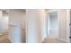 Second floor hallway showcasing the home's neutral color palette and carpet flooring at 160 Weldon Rd, Mcdonough, GA 30253