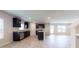 Open-concept living area featuring a modern kitchen with stainless appliances and an island at 160 Weldon Rd, Mcdonough, GA 30253