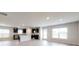 Open-concept living area featuring a modern kitchen with stainless appliances and ample natural light at 160 Weldon Rd, Mcdonough, GA 30253