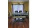 Dining area featuring a large window, hardwood floors and dining room seating at 645 Birchberry Sw Ter, Atlanta, GA 30331