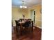 Traditional dining room with wood floors and a table set for four at 645 Birchberry Sw Ter, Atlanta, GA 30331