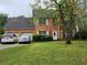 Charming two-story brick home with a well-manicured front yard and a two-car garage at 645 Birchberry Sw Ter, Atlanta, GA 30331