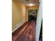 A shot of the hallway with wood flooring and neutral paint at 645 Birchberry Sw Ter, Atlanta, GA 30331