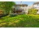 Expansive backyard featuring mature trees, a deck, and lush landscaping at 2810 Stillwater Park Dr, Marietta, GA 30066
