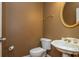 Cozy powder room with decorative mirror and toilet at 2810 Stillwater Park Dr, Marietta, GA 30066