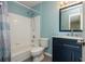 This bathroom features blue accents, modern fixtures, and a shower and bathtub combination at 2810 Stillwater Park Dr, Marietta, GA 30066