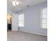This bedroom features carpeted floors, a ceiling fan, and two windows for lots of natural light at 2810 Stillwater Park Dr, Marietta, GA 30066
