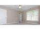 This bedroom features carpeted floors, a ceiling fan, and a window for lots of natural light at 2810 Stillwater Park Dr, Marietta, GA 30066