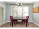 Inviting breakfast nook featuring a chandelier and large window, perfect for morning gatherings at 2810 Stillwater Park Dr, Marietta, GA 30066