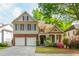 Charming two-story home boasts mature trees, well-manicured lawn and two-car garage at 2810 Stillwater Park Dr, Marietta, GA 30066