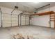 This spacious two-car garage has overhead storage and shelving at 2810 Stillwater Park Dr, Marietta, GA 30066