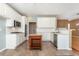 Well-equipped kitchen with white cabinets, stainless steel appliances, and a central island with granite countertop at 2810 Stillwater Park Dr, Marietta, GA 30066