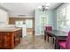 Spacious kitchen with access to living spaces, a breakfast nook, stainless steel appliances, and white cabinetry at 2810 Stillwater Park Dr, Marietta, GA 30066