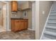 This laundry room features linoleum flooring, wood cabinets, and a utility sink at 2810 Stillwater Park Dr, Marietta, GA 30066