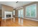 Bright living room features hardwood floors, a cozy fireplace, and a stylish light fixture at 2810 Stillwater Park Dr, Marietta, GA 30066