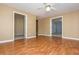 Open living room featuring hardwood floors, neutral paint, ceiling fan and multiple doorways at 2810 Stillwater Park Dr, Marietta, GA 30066