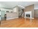 Inviting living room shows a cozy fireplace, hardwood flooring, and an adjacent kitchen area at 2810 Stillwater Park Dr, Marietta, GA 30066