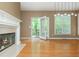 Bright living room features hardwood floors, fireplace, and access to deck at 2810 Stillwater Park Dr, Marietta, GA 30066
