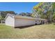 Exterior view from the backyard showing siding and concrete patio at 3998 Wabash Ln, Ellenwood, GA 30294