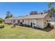 The back exterior view shows the house siding, backyard and concrete patio at 3998 Wabash Ln, Ellenwood, GA 30294