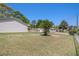 View of a backyard with a well maintained lawn and a fence at 3998 Wabash Ln, Ellenwood, GA 30294
