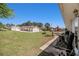View of a backyard with a well maintained lawn and an outdoor seating area at 3998 Wabash Ln, Ellenwood, GA 30294