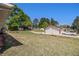 View of a large backyard with well maintained lawn and mature trees at 3998 Wabash Ln, Ellenwood, GA 30294