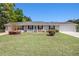 Attractive single-story home with a lush green lawn and a welcoming front entrance at 3998 Wabash Ln, Ellenwood, GA 30294