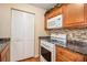 Modern kitchen with stainless steel oven and microwave, ample cabinet space, and a stylish backsplash at 3998 Wabash Ln, Ellenwood, GA 30294
