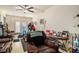 Spacious living room with a comfortable recliner, couch and access to the outdoor patio at 3998 Wabash Ln, Ellenwood, GA 30294