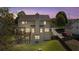 View of the home's backyard featuring a spacious deck, a patio, and a fire pit perfect for entertaining at 826 Buffington Way, Canton, GA 30115