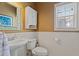 Powder room features white wainscoting, pedestal sink, and neutral wall color at 826 Buffington Way, Canton, GA 30115