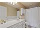 Bathroom featuring a shower and tub, a vanity with storage, and a towel rack at 826 Buffington Way, Canton, GA 30115