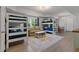 Spacious bedroom featuring multiple bunk beds and a cozy seating area at 826 Buffington Way, Canton, GA 30115
