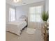 Bright bedroom features neutral paint, decor, carpet, and lots of natural light at 826 Buffington Way, Canton, GA 30115
