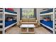 Spacious bedroom featuring multiple bunk beds and a cozy seating area at 826 Buffington Way, Canton, GA 30115