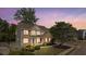 Charming two-story brick home featuring a well-manicured lawn and inviting front porch with beautiful landscaping at 826 Buffington Way, Canton, GA 30115