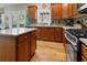 Modern kitchen with stainless steel appliances, hardwood floors, and light countertops at 826 Buffington Way, Canton, GA 30115