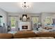Bright living room features fireplace, hardwood floors, and stylish decor at 826 Buffington Way, Canton, GA 30115