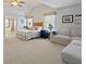 Bright main bedroom with sitting area and ensuite bathroom featuring a soaking tub at 826 Buffington Way, Canton, GA 30115