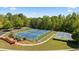 Overhead shot showcasing community tennis and basketball courts with lush, mature trees in the background at 826 Buffington Way, Canton, GA 30115