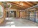 Unfinished basement shows exposed wood beams, duct work, concrete floors, and some metal shelving at 1740 Manhasset Pl, Atlanta, GA 30338