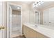 Bathroom with single vanity, large mirror, and door to toilet and shower combo at 1740 Manhasset Pl, Atlanta, GA 30338